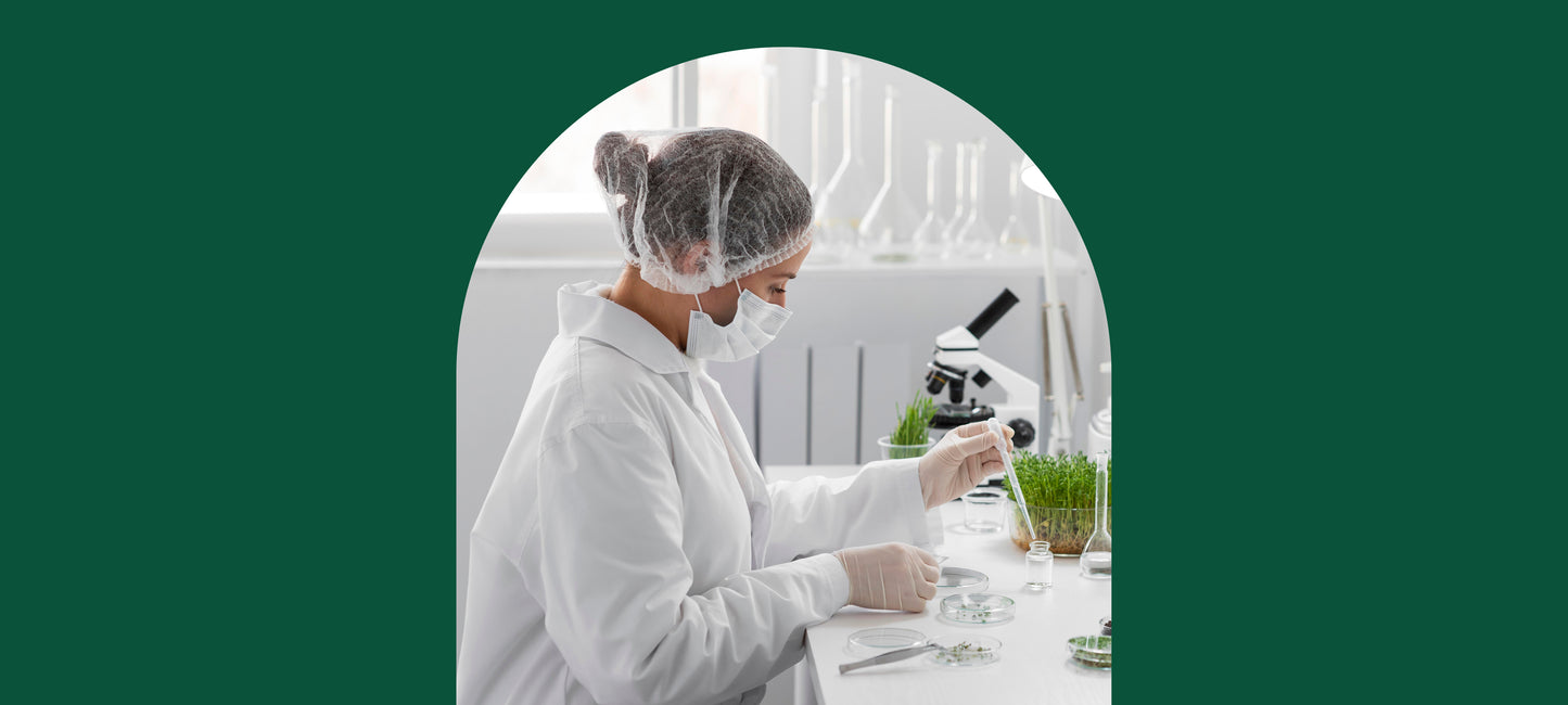A woman lab technician testing plants in a lab.