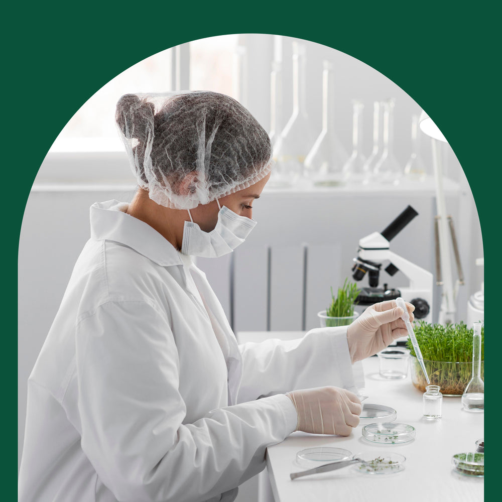 A woman lab technician testing plants in a lab.